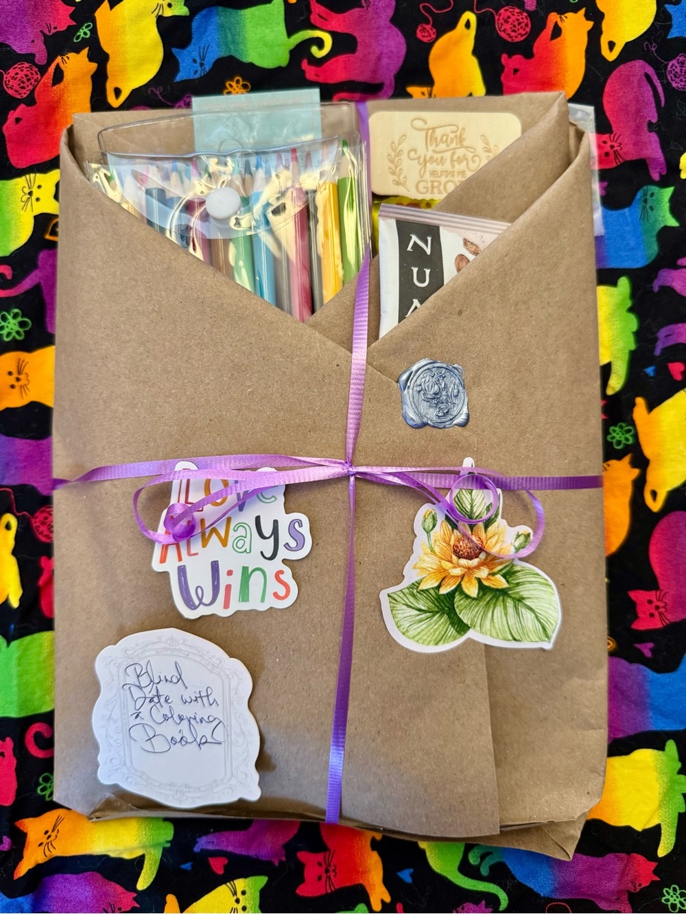 Gift Book Bundle Wrapped in Brown Kraft Paper with Purple Ribbon